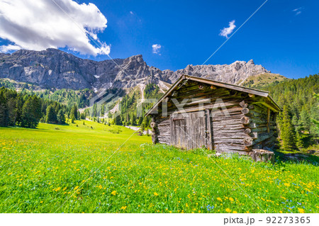 Agricultural barn for hay in Dolomites meadows, Northern Italy Agricultural barn for hay in Dolomites meadows, Northern Italy 92273365