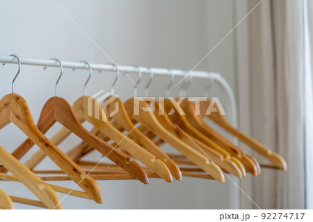 Close-up of wardrobe with wooden clothes hanger, Close-up of wardrobe with wooden clothes hanger, 92274717