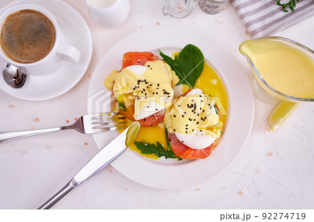 Eggs Benedict with Cream cheese and Smoked salmon on a plate Eggs Benedict with Cream cheese and Smoked salmon on a plate 92274719