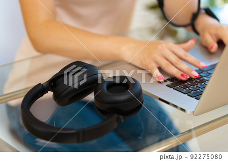 Close up of woman hands typing on laptop keyboard at the office 92275080