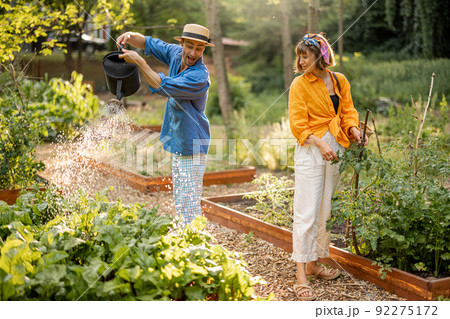 Farmers work at home garden or local farmland Farmers work at home garden or local farmland 92275172