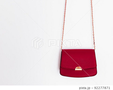 Red fashionable leather purse with gold details as designer bag and stylish accessory, female fashion and luxury style handbag collection concept Red fashionable leather purse with gold details as designer bag and stylish accessory, female fashion and luxury style handbag collection concept 92277871