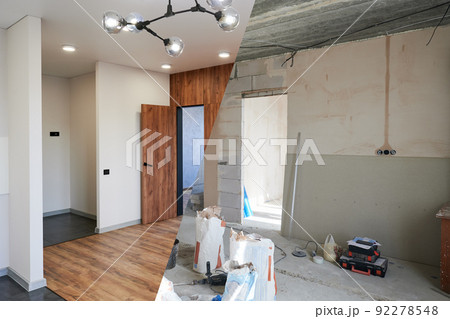 Comparison of old room with building tools and new renovated room. Photo collage of apartment before and after restoration. Concept of home renovation. 92278548