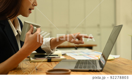 Cropped shot of female employee having problems with laptop, solving business problem 92278803