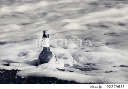 Bottle of wine in sea surf 92279653