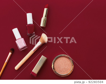 Beauty, make-up and cosmetics flatlay design with copyspace, cosmetic products and makeup tools on burgundy background, girly and feminine style concept 92283504