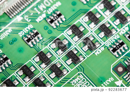 Close-up of a green computer printed circuit board with chips Close-up of a green computer printed circuit board with chips 92283677