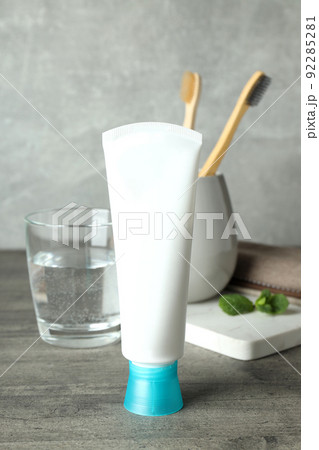 Concept of tooth care on gray wooden table 92285281