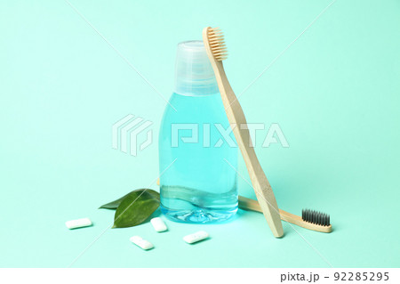 Concept of tooth care on mint background Concept of tooth care on mint background 92285295