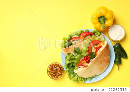 Concept of tasty food with pitas with chicken meat Concept of tasty food with pitas with chicken meat 92285536