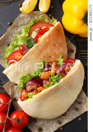 Concept of tasty food with pitas with chicken meat 92286175