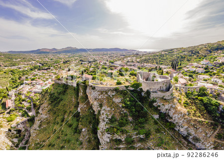 Old city. Sunny view of ruins of citadel in Stari Bar town near Bar city, Montenegro. Drone view Portrait of a disgruntled girl sitting at a cafe table Old city. Sunny view of ruins of citadel in Stari Bar town near Bar city, Montenegro. Drone view Portrait of a disgruntled girl sitting at a cafe table 92286246