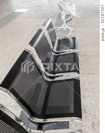 The new modern metal chair is in a row in front of the ticket booth. The new modern metal chair is in a row in front of the ticket booth. 92287307