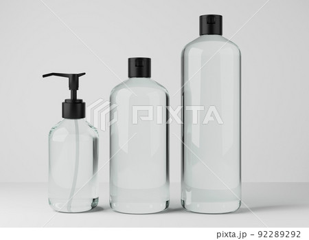Different transparent glass bottles for hair and body care products 3D render, set of cosmetic containers on gray studio background, packaging mockup 92289292