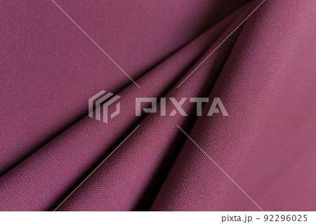Pink crumpled or wavy fabric texture background. Abstract linen cloth soft waves. Gabardine wool fabric. Merino yarn. Smooth elegant luxury cloth texture. Concept for banner or advertisement. Pink crumpled or wavy fabric texture background. Abstract linen cloth soft waves. Gabardine wool fabric. Merino yarn. Smooth elegant luxury cloth texture. Concept for banner or advertisement. 92296025