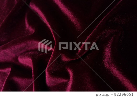 Red velvet crumpled or wavy fabric texture background. Abstract linen cloth soft waves. Merino yarn. Smooth elegant luxury cloth texture. Concept for banner or advertisement. Red velvet crumpled or wavy fabric texture background. Abstract linen cloth soft waves. Merino yarn. Smooth elegant luxury cloth texture. Concept for banner or advertisement. 92296051