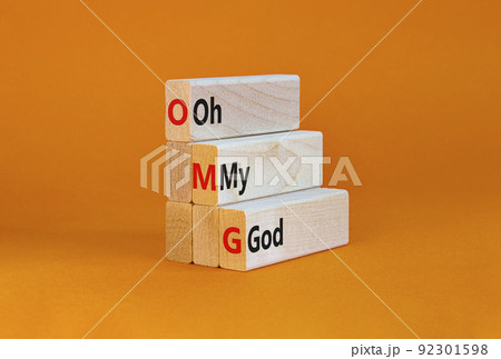 OMG oh my god symbol. Concept words OMG oh my god on wooden blocks on a beautiful orange table, orange background. Business and OMG oh my god concept. Copy space. OMG oh my god symbol. Concept words OMG oh my god on wooden blocks on a beautiful orange table, orange background. Business and OMG oh my god concept. Copy space. 92301598