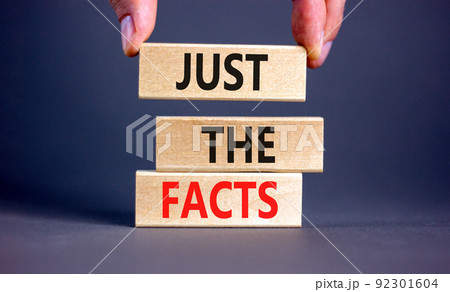 Just the facts symbol. Concept words Just the facts on wooden blocks on a beautiful grey table grey background. Businessman hand. Business and just the facts concept. Copy space. Just the facts symbol. Concept words Just the facts on wooden blocks on a beautiful grey table grey background. Businessman hand. Business and just the facts concept. Copy space. 92301604