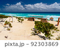 Sandy beach with azure water on a sunny day near Cancun, Mexico 92303869
