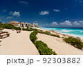 Sandy beach with azure water on a sunny day near Cancun, Mexico 92303882