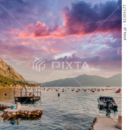 Fishing Boat On An Oyster Farm In The Bay Of Kotor, Montenegro. High Quality Photo Fishing Boat On An Oyster Farm In The Bay Of Kotor, Montenegro. High Quality Photo 92304177