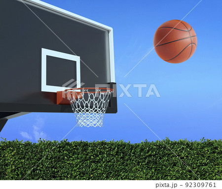 A player throws a basketball towards the net and trying to get a score A player throws a basketball towards the net and trying to get a score 92309761