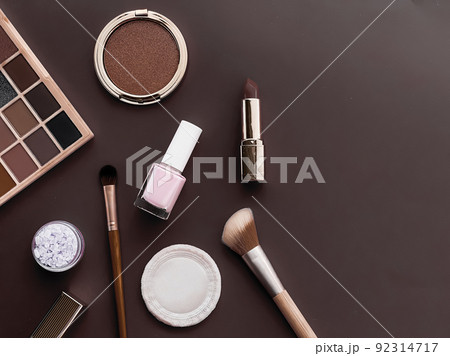 Beauty, make-up and cosmetics flatlay design with copyspace, cosmetic products and makeup tools on brown background, girly and feminine style concept 92314717