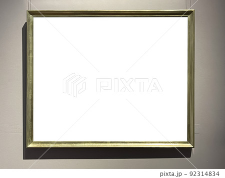 Antique wooden art fair gallery frame on the wall at auction house or museum exhibition, blank template with empty white copyspace for mockup design, artwork concept Antique wooden art fair gallery frame on the wall at auction house or museum exhibition, blank template with empty white copyspace for mockup design, artwork concept 92314834