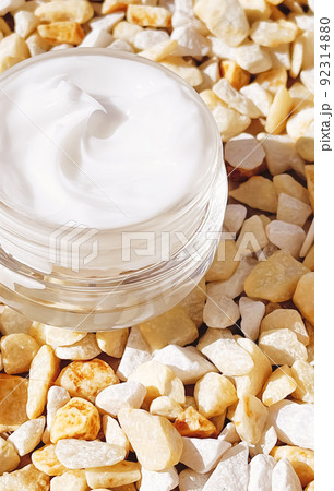 Face cream moisturiser, glass jar on stone background, skincare and cosmetic, beauty product concept Face cream moisturiser, glass jar on stone background, skincare and cosmetic, beauty product concept 92314880