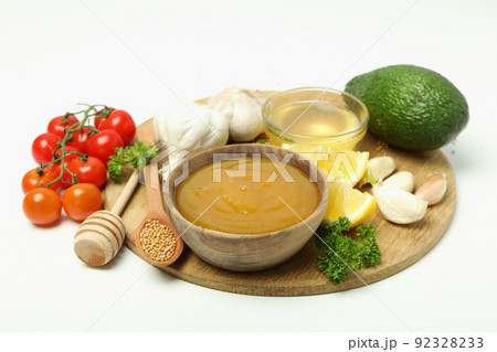 Concept of cooking with honey mustard sauce and ingredients Concept of cooking with honey mustard sauce and ingredients 92328233