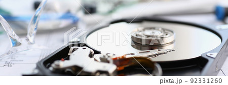 Disassembled hard drive from pc hdd and reader arm, made of plastic and metal Disassembled hard drive from pc hdd and reader arm, made of plastic and metal 92331260