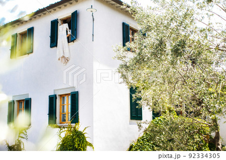 Weddign dress in the window of an Italian villa Weddign dress in the window of an Italian villa 92334305
