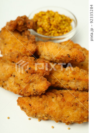 Concept of tasty food with Chicken strips, close up Concept of tasty food with Chicken strips, close up 92335284