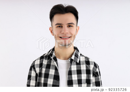 Attractive guy in shirt on white background 92335726