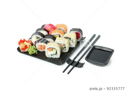 Concept of tasty food with sushi rolls isolated on white background Concept of tasty food with sushi rolls isolated on white background 92335777