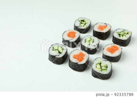 Concept of tasty food with maki on white background Concept of tasty food with maki on white background 92335786