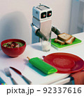 Cute robot cooking the soup  92337616