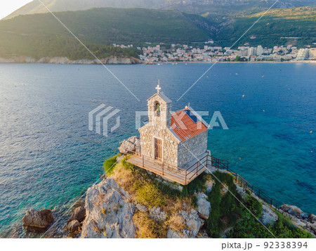 Sveta Nedelja is an islet on the Adriatic Sea, in Montenegrin municipality of Budva. It is located opposite the town of Petrovac na Moru in Montenegro. It has a small church on it Portrait of a 92338394