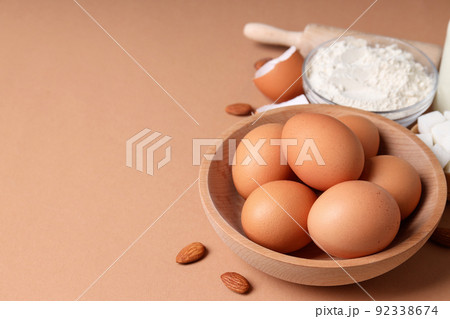 Ingredients for pie or cake cooking on light brown background Ingredients for pie or cake cooking on light brown background 92338674