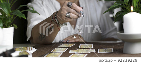 Concept of psychic advisor or ways of divination with cards. Concept of psychic advisor or ways of divination with cards. 92339229