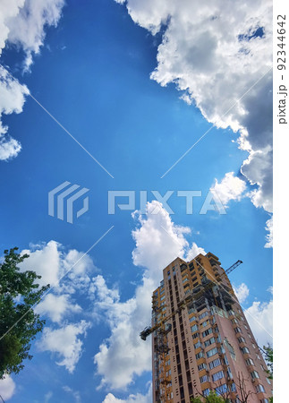 Kyiv, Ukraine - July 10, 2022: The building renovation after Russian rocket attack on Kyiv. Kyiv, Ukraine - July 10, 2022: The building renovation after Russian rocket attack on Kyiv. 92344642
