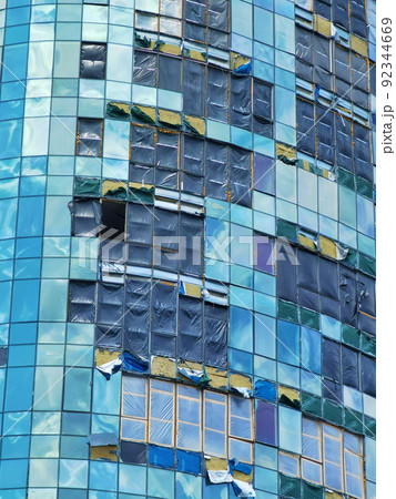Kyiv, Ukraine - July 10, 2022: The building renovation after Russian rocket attack on Kyiv Kyiv, Ukraine - July 10, 2022: The building renovation after Russian rocket attack on Kyiv 92344669