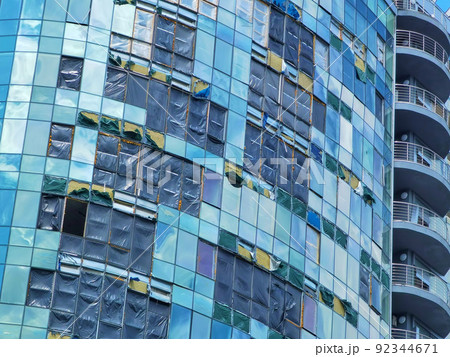 Kyiv, Ukraine - July 10, 2022: The building renovation after Russian rocket attack on Kyiv Kyiv, Ukraine - July 10, 2022: The building renovation after Russian rocket attack on Kyiv 92344671