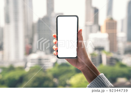hand holding phone mobile white blank screen 92344739