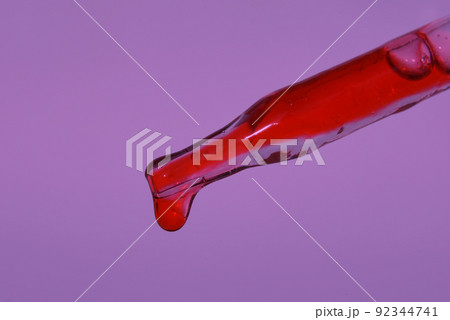 Pipette with a drop of blood on the background of the color of the year 2022. Blood for injection, plasmolifting. Cosmetic procedure for the skin of the face using blood. High quality photo Pipette with a drop of blood on the background of the color of the year 2022. Blood for injection, plasmolifting. Cosmetic procedure for the skin of the face using blood. High quality photo 92344741