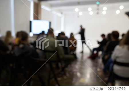 Blurred background of the business conference, one man on the stage, presentation of the project, public talk. High quality photo Blurred background of the business conference, one man on the stage, presentation of the project, public talk. High quality photo 92344742
