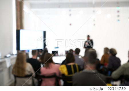 Blurred background of the business conference, one man on the stage, presentation of the project, public talk. High quality photo Blurred background of the business conference, one man on the stage, presentation of the project, public talk. High quality photo 92344789