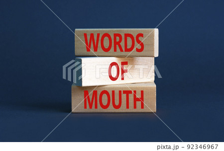 Words of mouth symbol. Concept words Words of mouth on wooden blocks on a beautiful grey table grey background. Business, finacial and words of mouth concept. Copy space. 92346967