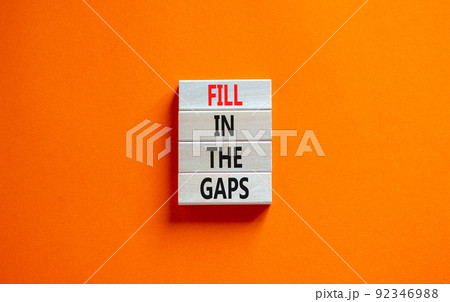 Fill in the gaps symbol. Concept words Fill in the gaps on wooden blocks on a beautiful orange table orange background. Business, motivational and fill in the gaps concept. Fill in the gaps symbol. Concept words Fill in the gaps on wooden blocks on a beautiful orange table orange background. Business, motivational and fill in the gaps concept. 92346988