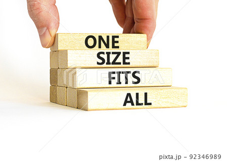 One size fits all symbol. Concept words One size fits all on wooden blocks. Businessman hand. Beautiful white table white background. One size fits all business concept. Copy space. 92346989